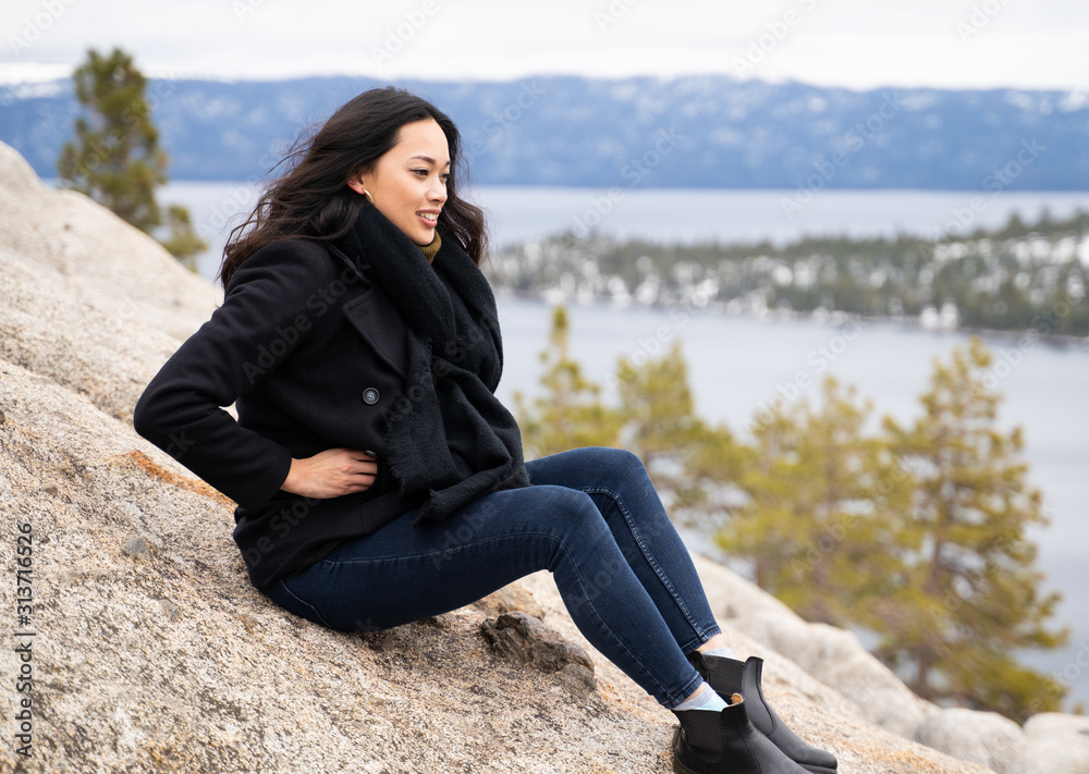 Female Asian model overlooking lake and mountain view Female Asian model overlooking lake and mountain view