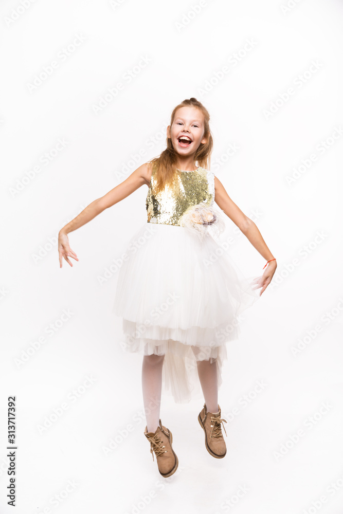 Young girl in the Studio on a white background.The girl shows emotions Young girl in the Studio on a white background.The girl shows emotions