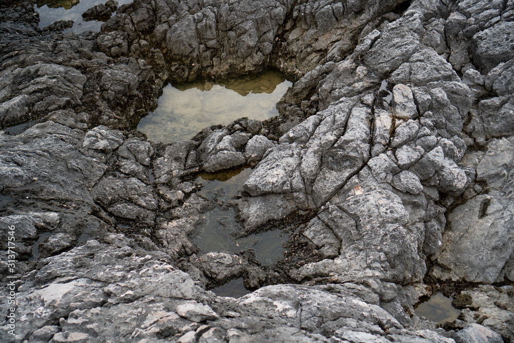 Water washes a rocky shore