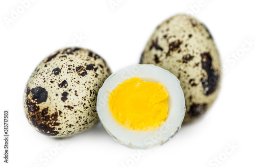 Some Quail Eggs isolated on white (selective focus)