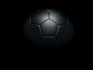 Black soccer ball against black background.
