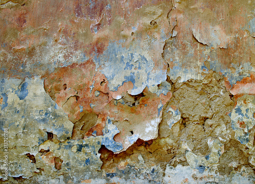 The texture of the old battered wall. Dirty stucco, abstract background