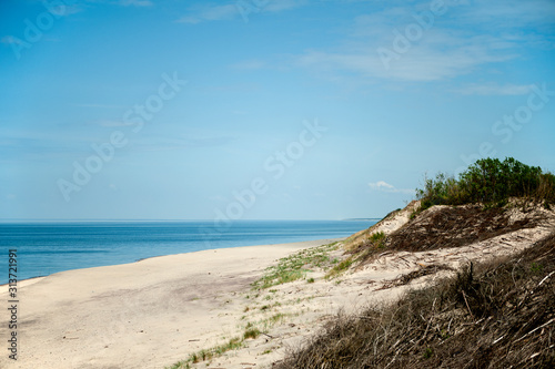 Sand dunes and sea on the Curonian Spit on a summer sunny day. Curonian Spit, Russia