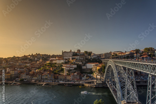 Porto, Portugal - Old town wine port skyline with douro river and Dom Luis iron bridge at sunset
