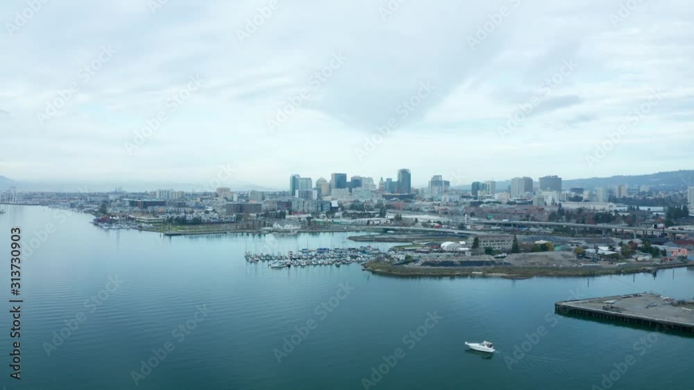 Beautiful skies and waters in the bay on a misty cloudy urban city day. Beautiful skies and waters in the bay on a misty cloudy urban city day.