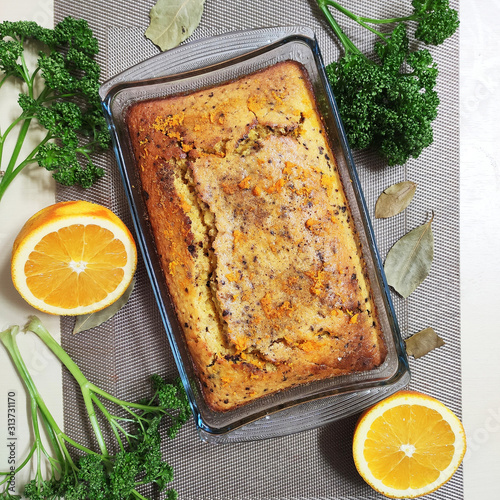 Delicious orange and coffee cake. Background with beautiful pastries and herbs