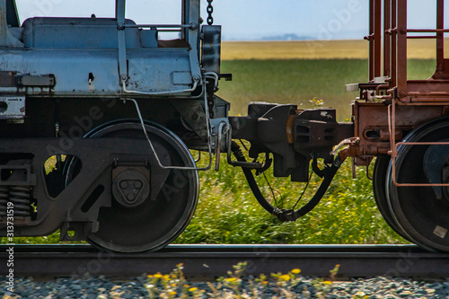 Billede på lærred Close up of train coupler connecting two wagons of a Canadian freight or cargo train