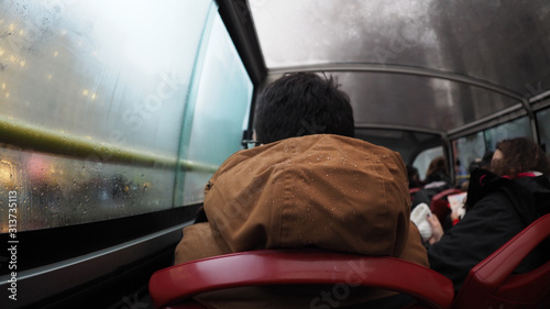 Canvas Print Jacket with water droplets on a public bus