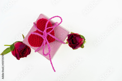 valentine gift, pink box and red heart tied with pink rope around with red rose, valentien and wedding concept .