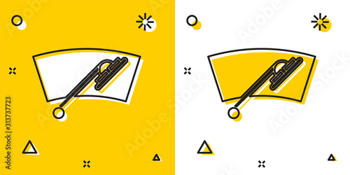 Black Windscreen wiper icon isolated on yellow and white background. Random dynamic shapes. Vector Illustration