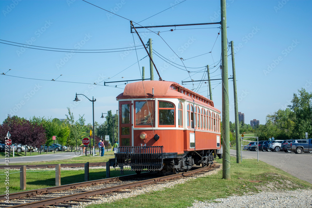 Historic trolley transit train running with passengers Historic trolley transit train running with passengers