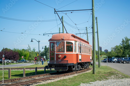 Historic trolley transit train running with passengers