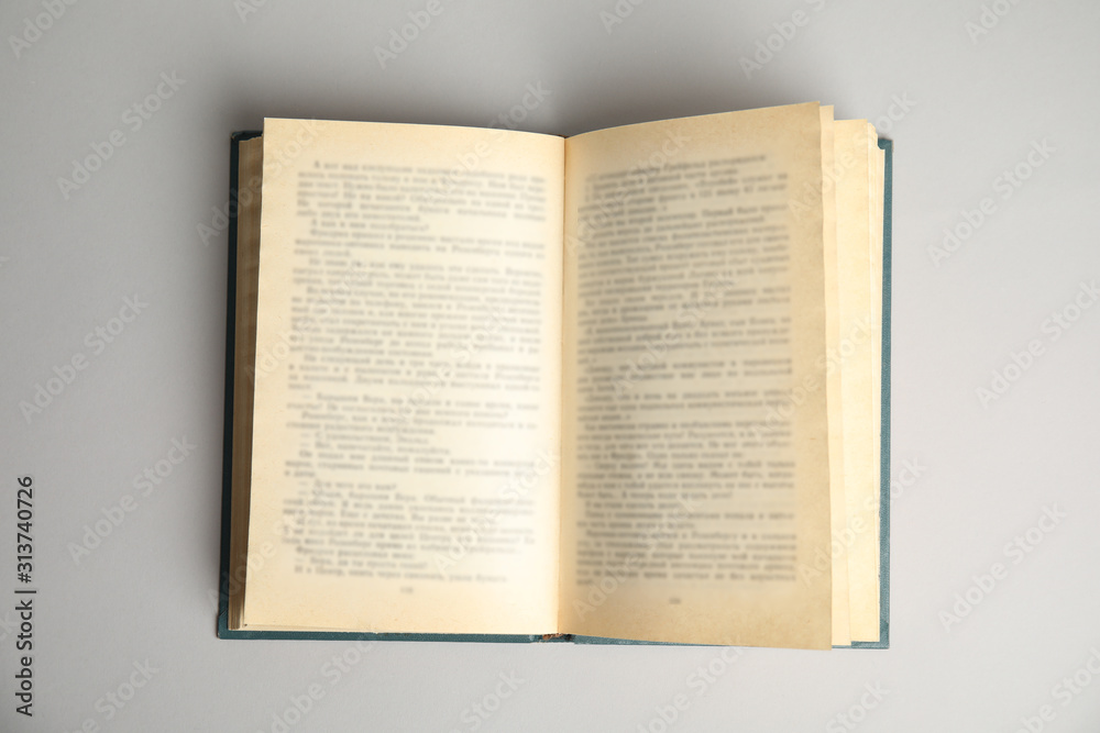 Obraz premium Open book on light grey background, top view. Space for text