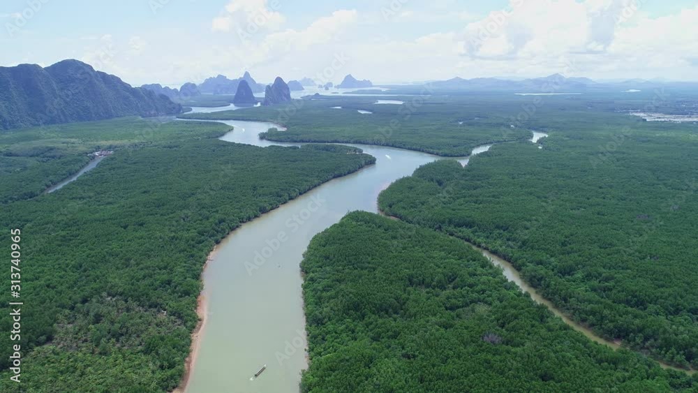 Aerial view drone shot of beautiful natural scenery river in mangrove forest and high mountains in phang nga province Thailand Aerial view drone shot of beautiful natural scenery river in mangrove forest and high mountains in phang nga province Thailand