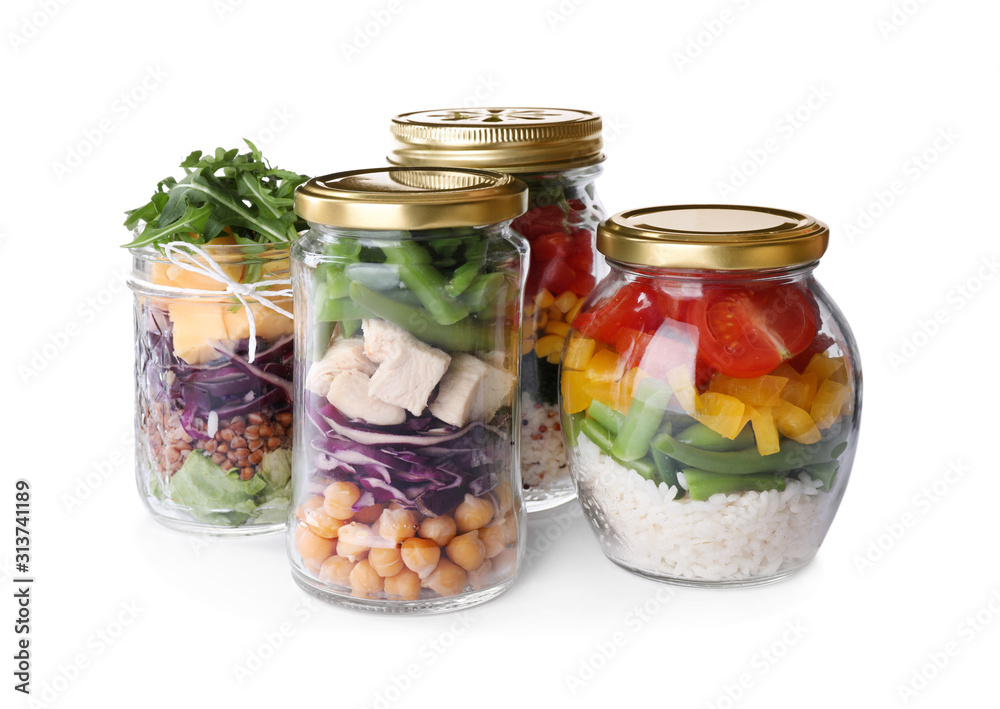 Glass jars with healthy meal isolated on white