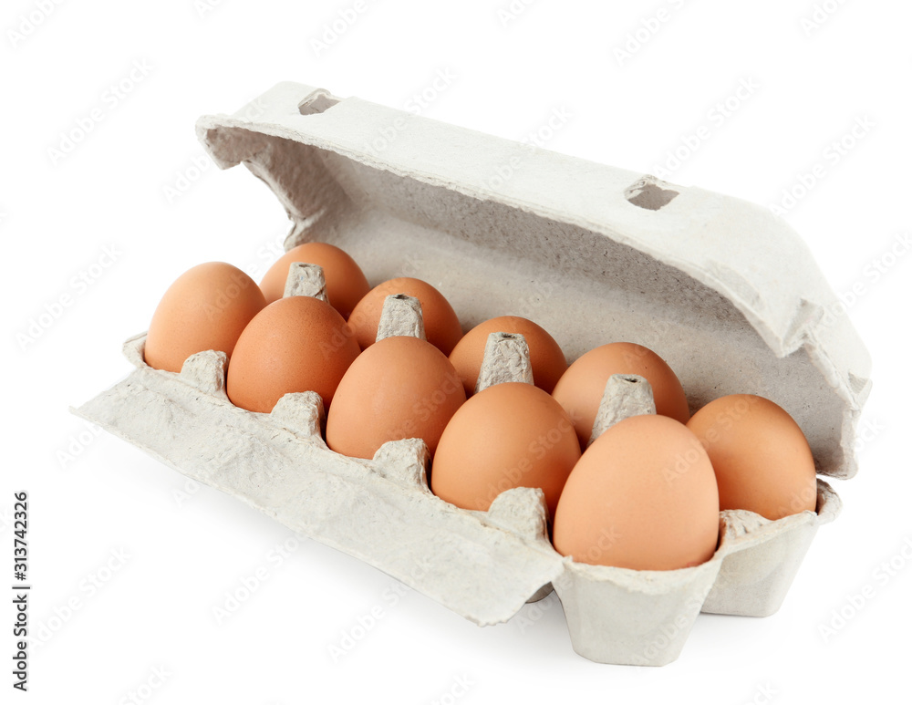 Raw chicken eggs in carton isolated on white