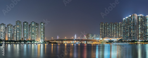 Photography Panorama of harbor and skyline of Hong Kong city at night