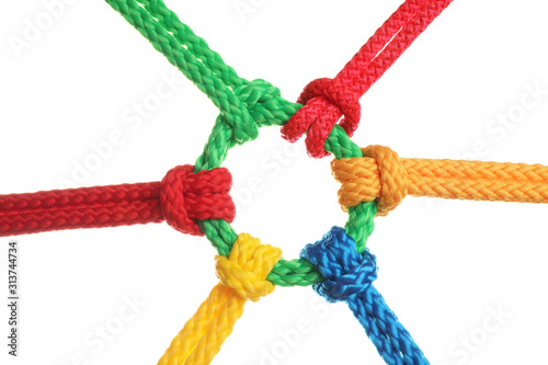 Colorful ropes tied together isolated on white. Unity concept