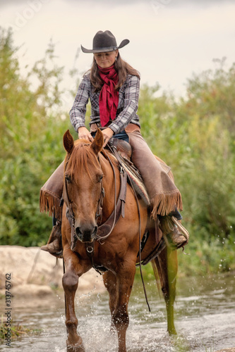 Horseback Riding in Creek © Terri Cage 