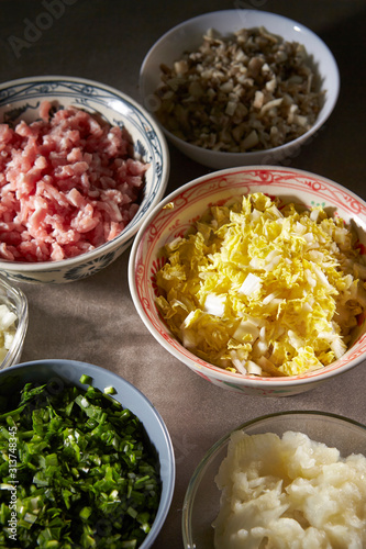 Dumpling meat and vegetable ingredient in bowls 