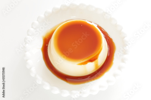 Caramel and baked pudding on white dish