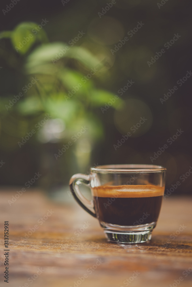 Espresso shot on wood table in cafe shop. Espresso shot on wood table in cafe shop.