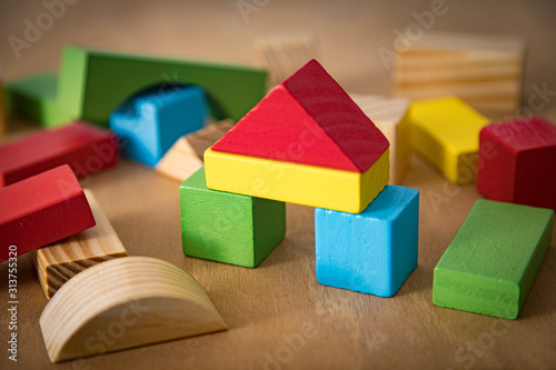 Colorful wooden block for kids. Toddler toys. Building learning concept
