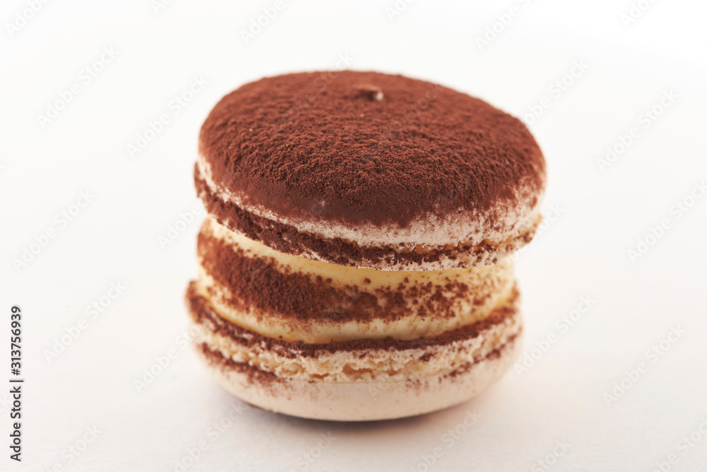 Cocoa powder macaroon on white background Cocoa powder macaroon on white background