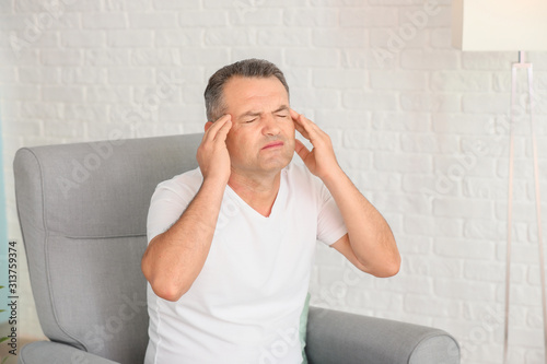 Mature man suffering from h...