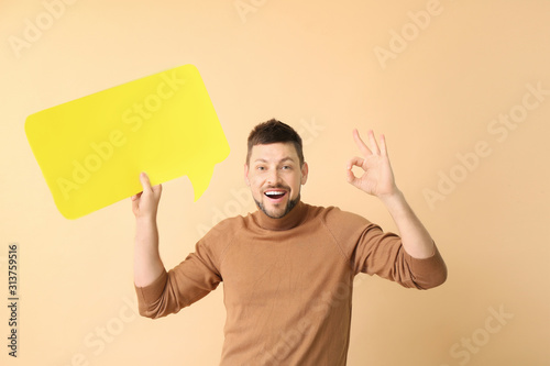 Man with blank speech bubbl...