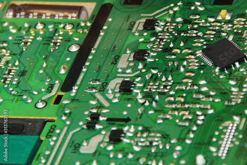 Green modern TV motherboard close up, Digital electronics repair