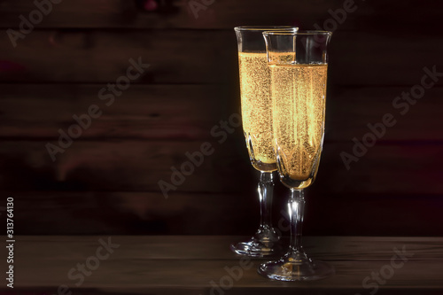 wine glass of sparkling champagne on a dark background
