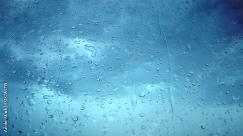 The stains of rain falling on the glass.