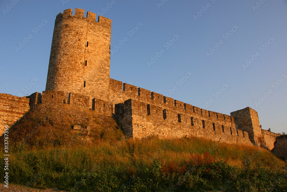 Walls and watchtower of Kalemegdan fortress at sunset in Belgrade, Serbia