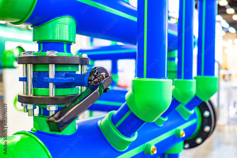 Pipes. Water supply from the well. Pipeline. The crane on plastic pipes ...