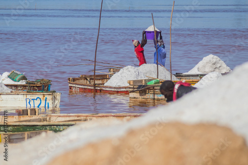 Photography LAC ROSE, SENEGAL, FEBRUARY 17 2017: people harvesting salt on Lac Rose or Lake Retba, close to Dakar in Senegal