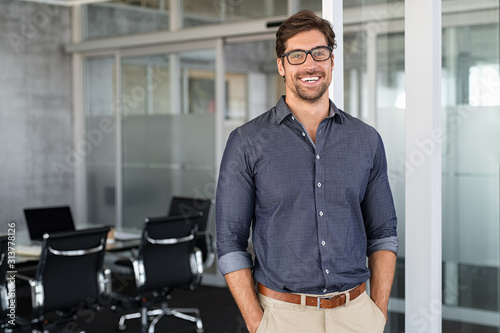 Success businessman smiling in office photo