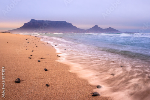 View of Table Mountain at sunrise from Milnerton Beach, Cape Town, South Africa 