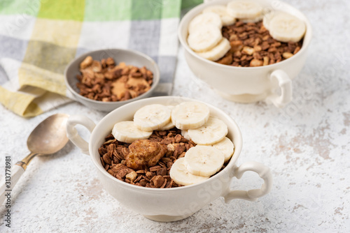 Granola, oatmeal with banana food background