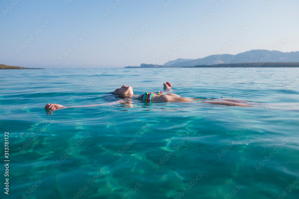 Woman relaxing in the sea