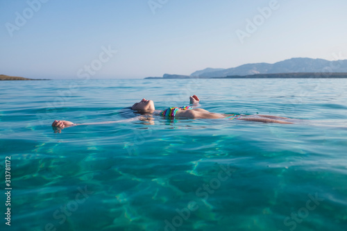 Woman relaxing in the sea © archimede