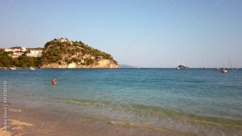 People swimming at beach in Parga Greece in the afternoon, establisher People swimming at beach in Parga Greece in the afternoon, establisher