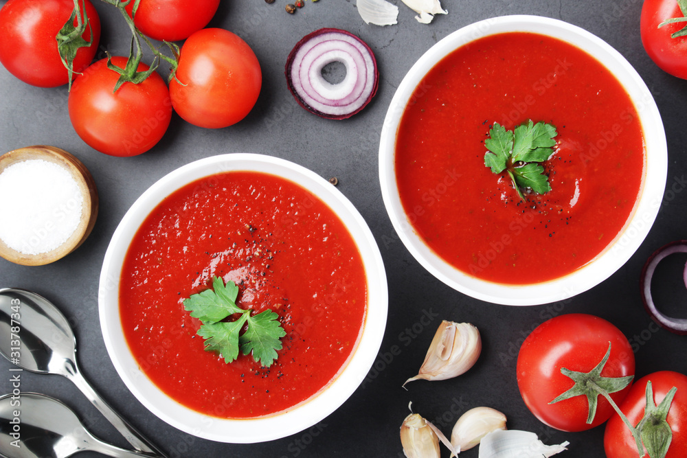 Two plates with gazpacho - traditional Spanish tomato soup Two plates with gazpacho - traditional Spanish tomato soup
