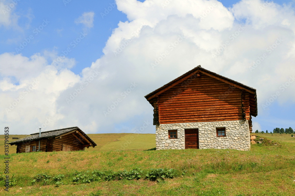 Old wooden barn in the mountain. Italian Dolomites. Old wooden barn in the mountain. Italian Dolomites.