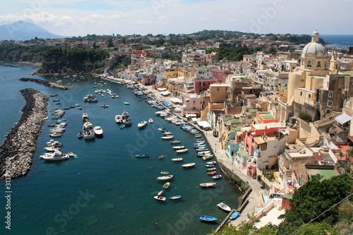 Scenic view of the harbor in Corricella on Procida  Golfo di Napoli  Italy  with the vibrantly colorful houses painted in different pastel shades