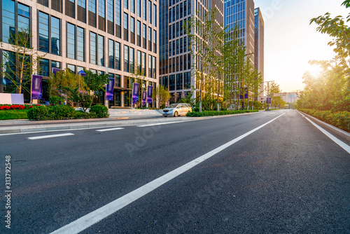 Road pavement and modern building in Jinan financial district © 昊 周