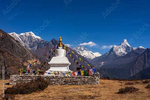 Buddhist stupa on the background of the Himalayan mountains. Nepal. Himalayas. Panorama of the Himalayan mountains. Trekking in the Himalayas.