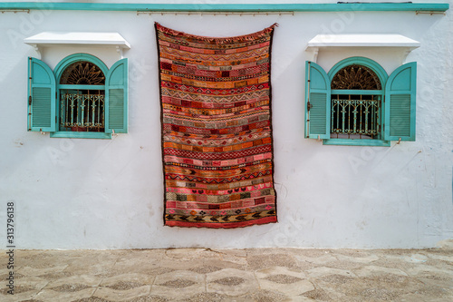 Moroccan  carpets in the street shop souk of Asilah, Morocco