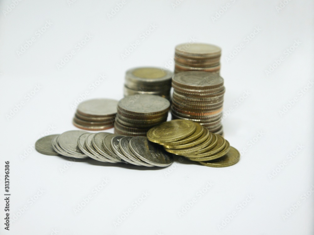 Several Thai coins isolated on white background, heap of coins silver gold, copper thai coin, baht currency. Several Thai coins isolated on white background, heap of coins silver gold, copper thai coin, baht currency.