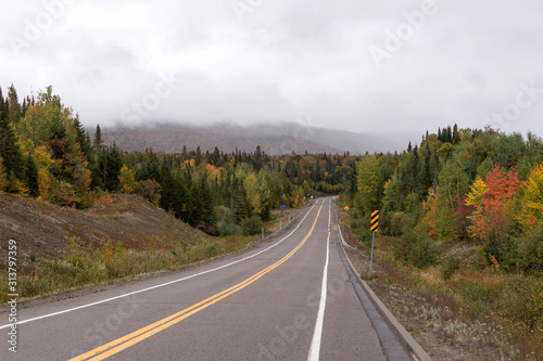 Empty street in the Mauricie National Park in Indian Summer. Canada